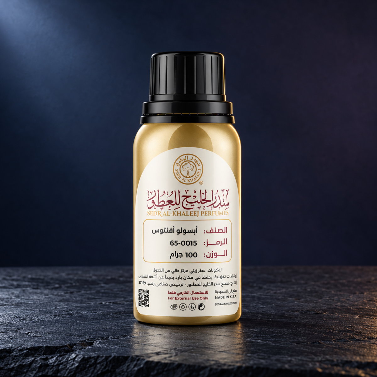 Sedr Al-Khaleej Absolu Aventus inspired perfume oil, gold bottle on dark slate against a deep blue backdrop with cool side light and a warm rim
