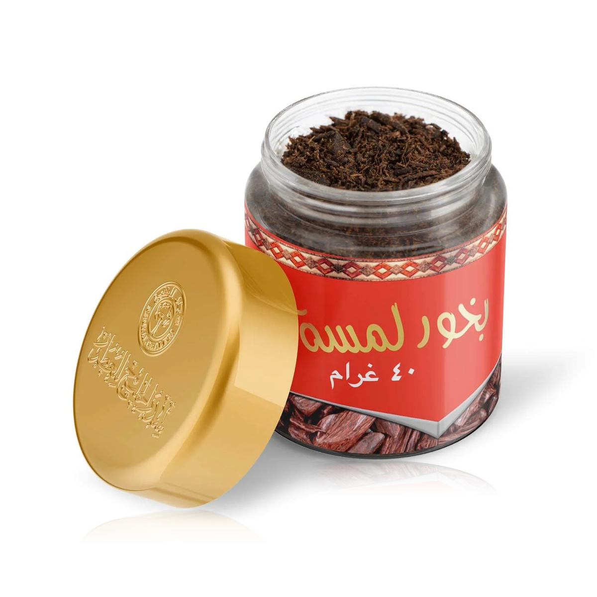 Lamsa Bakhoor 40 g jar open to show the brown bakhoor pieces, its gold lid propped beside it