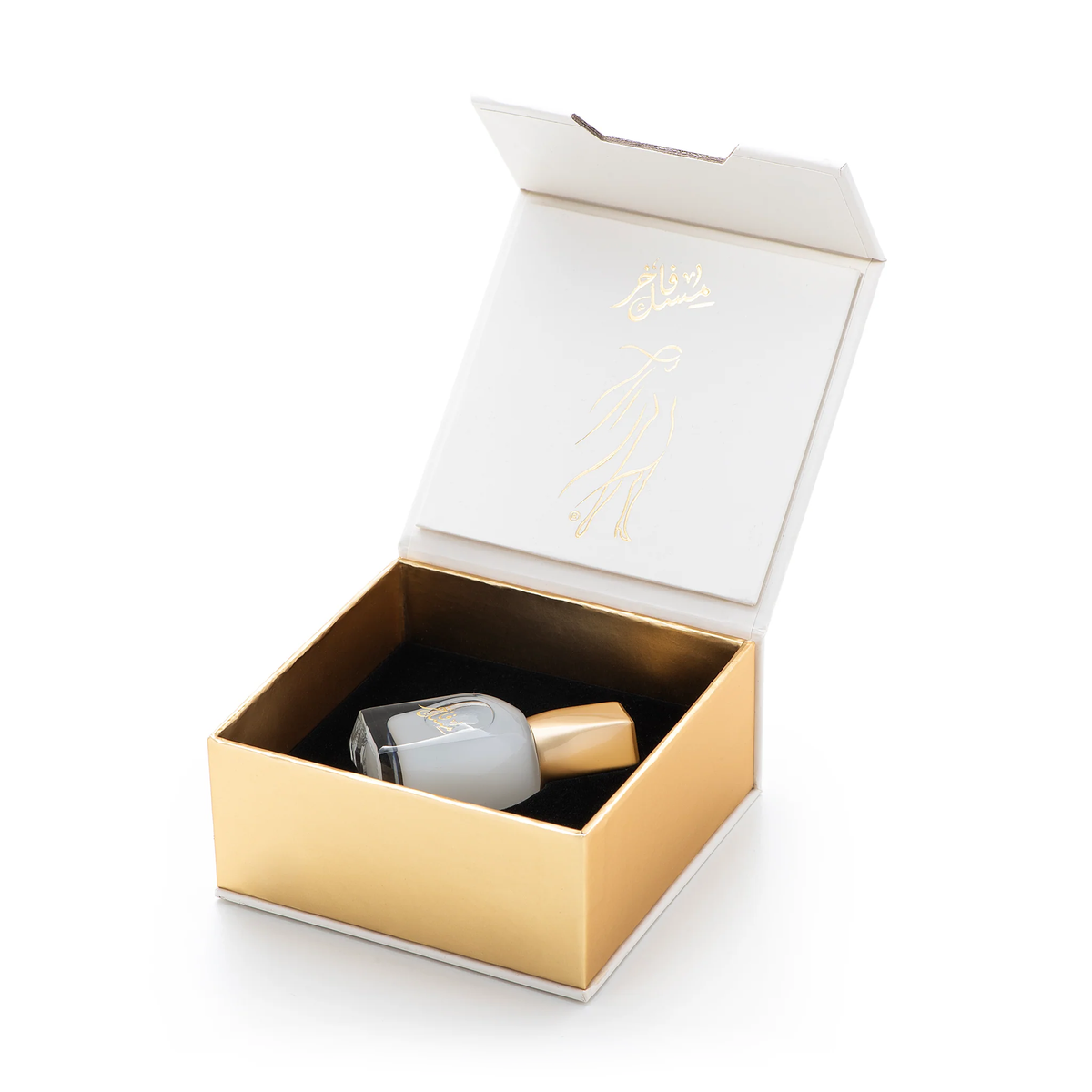 Musk Fakher oil from the Shatha Al Musk Bundle inside its open gold box on a white background