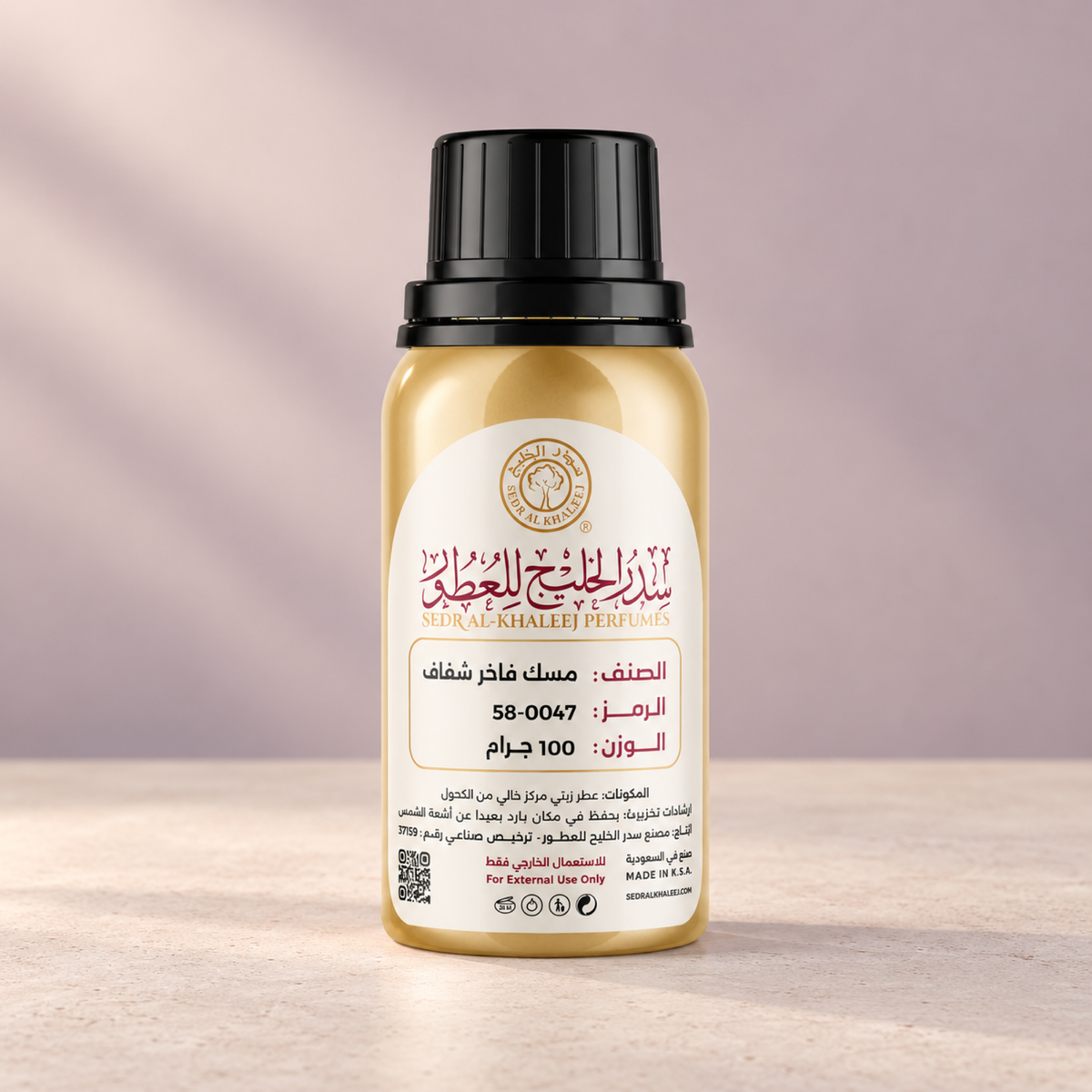 Sedr Al-Khaleej musk fakher transparent perfume oil; one closed original bottle on pale cream matte concrete before a pale apricot, faded lilac grey backdrop.