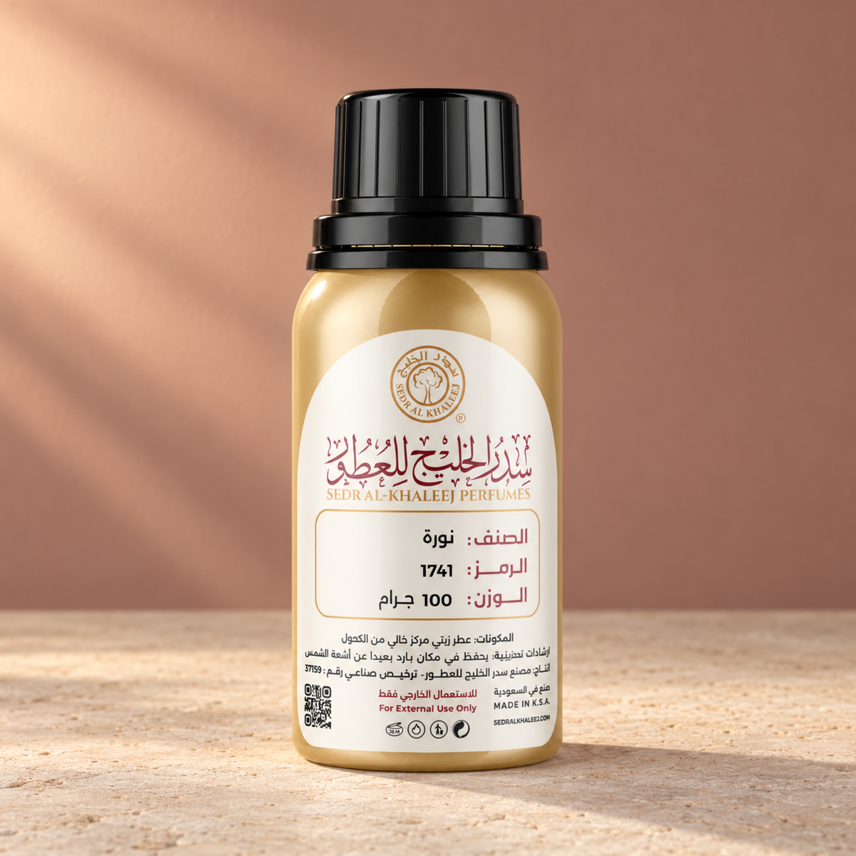 Sedr Al-Khaleej noura perfume oil; one closed original bottle on chalky ivory limestone before a muted saffron beige, dusty rose backdrop.