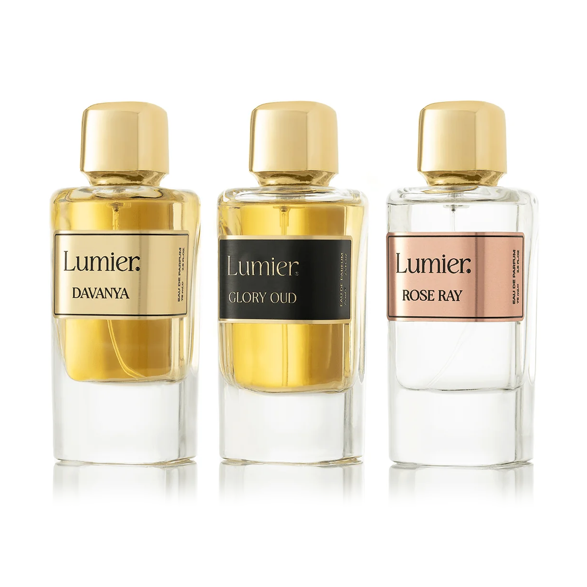 Radiance Bundle: three Lumier bottles, Davanya, Glory Oud and Rose Ray, with gold caps on a white background