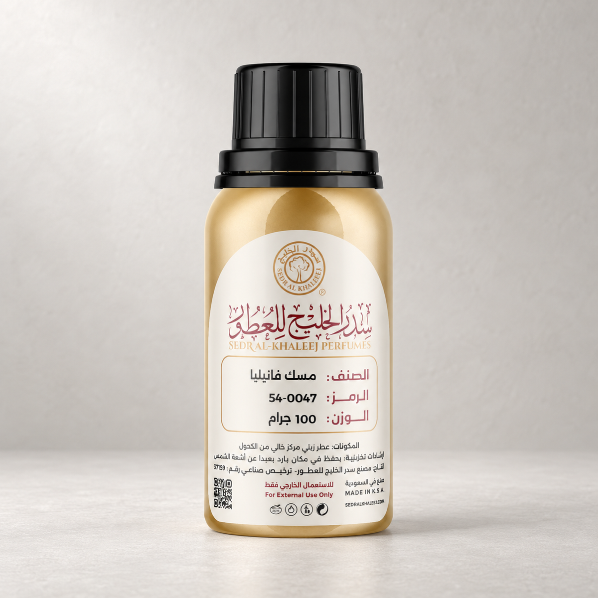 Sedr Al-Khaleej vanilla musk perfume oil; one closed original bottle on matte ivory porcelain with smooth tactile surface, against pearl-grey seamless plaster backdrop.