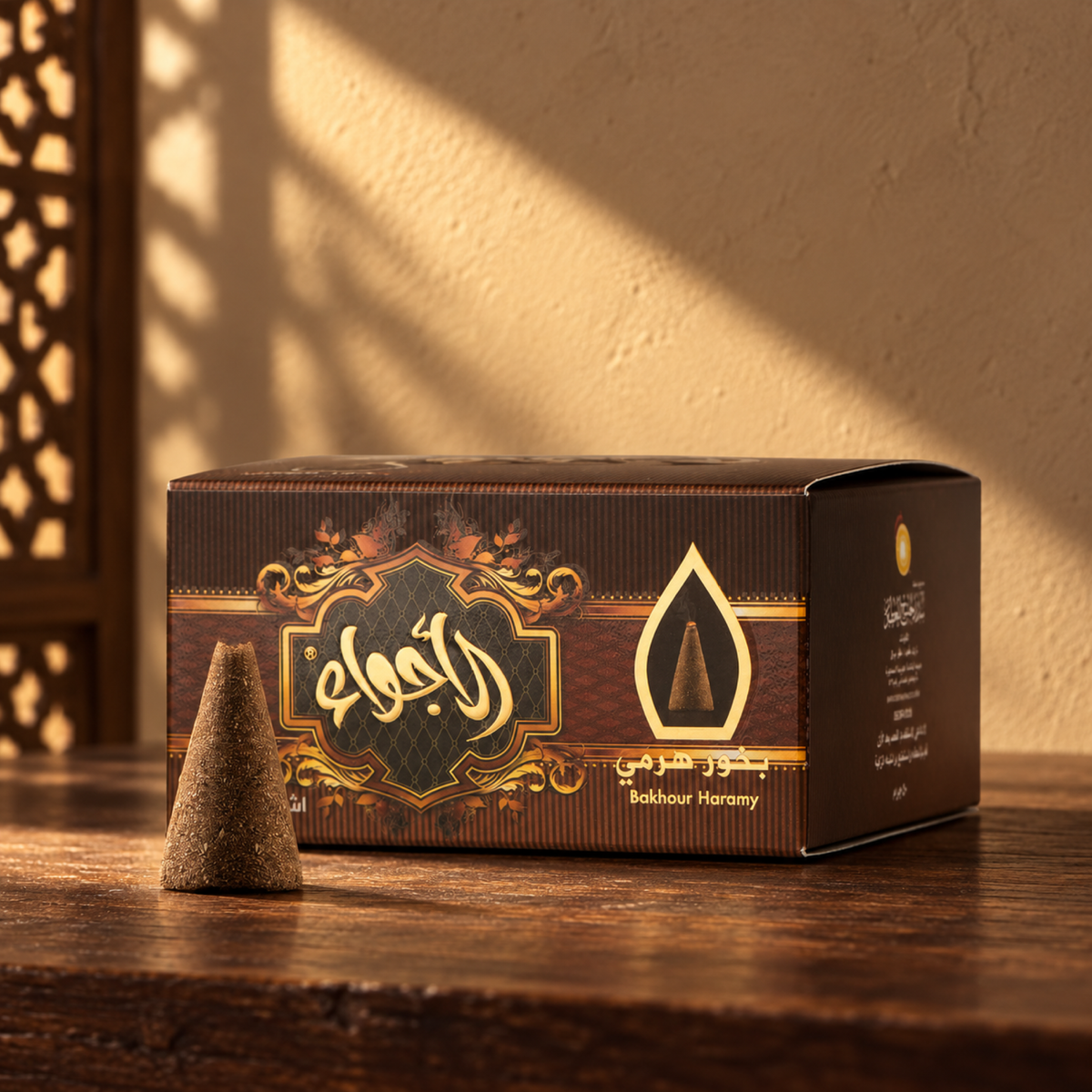 Al Ajwaa Pyramid Bakhoor 50 g from Sedr Al-Khaleej; brown incense box with one cone on walnut wood against a sand-coloured wall in angled sunlight.