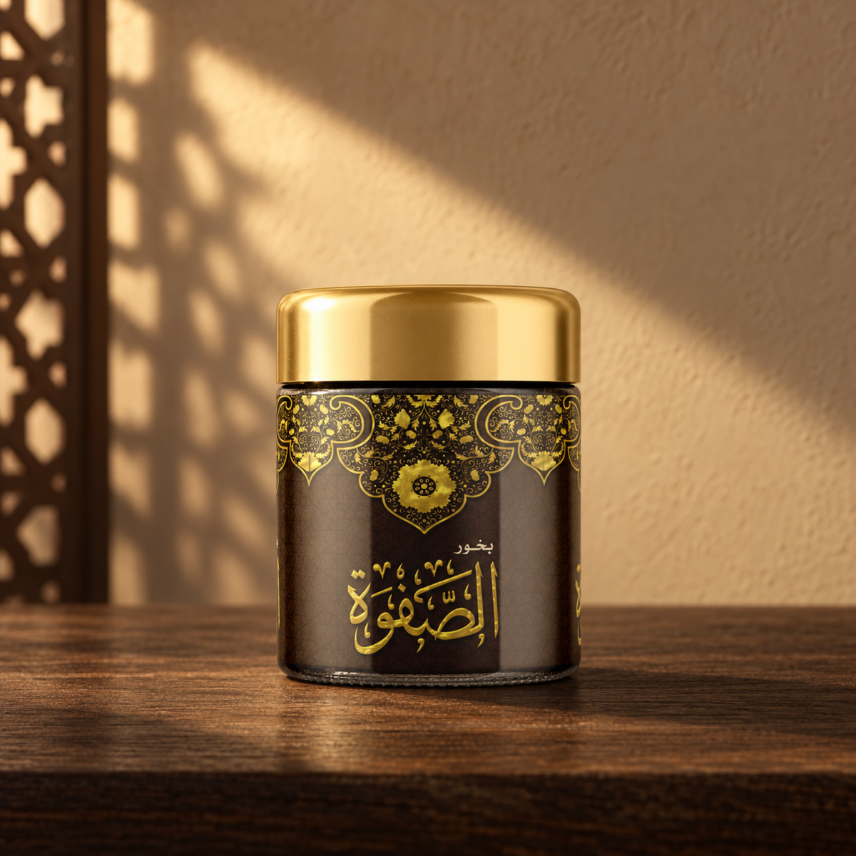 Al Safwah Bakhoor 40 g from Sedr Al-Khaleej; incense jar with a gold lid and ornate dark label on wood in sunlight.