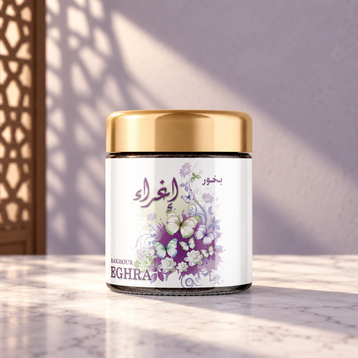 Eghra Bakhoor 40 g from Sedr Al-Khaleej; incense jar with a gold lid and white lilac label on marble in sunlight.
