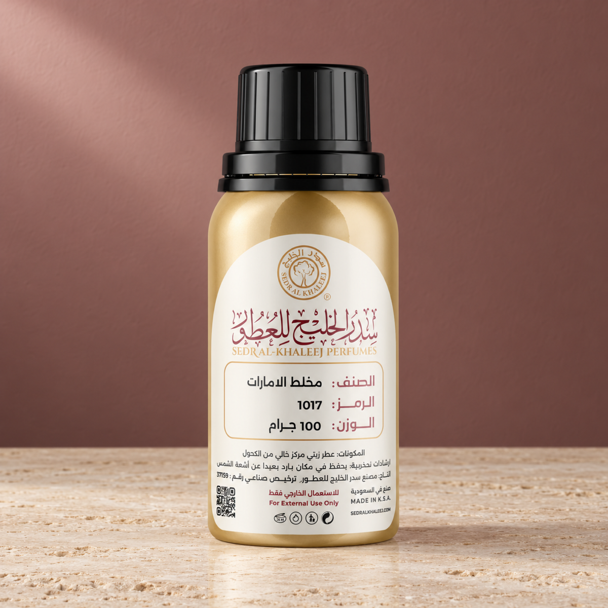 Sedr Al-Khaleej emirates mukhalat perfume oil; one closed original bottle on matte cream travertine before a muted rosewood, cream stone backdrop.