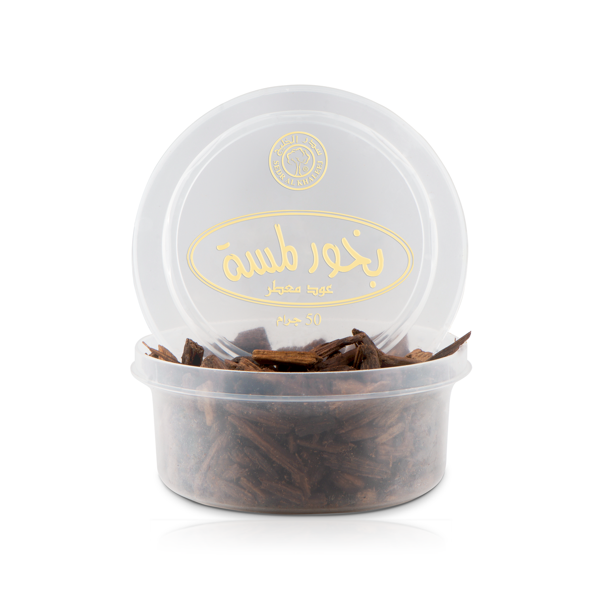Lamsa Bakhoor Scented Oud 50 g: scented oud chips in an open clear container with its lid behind it