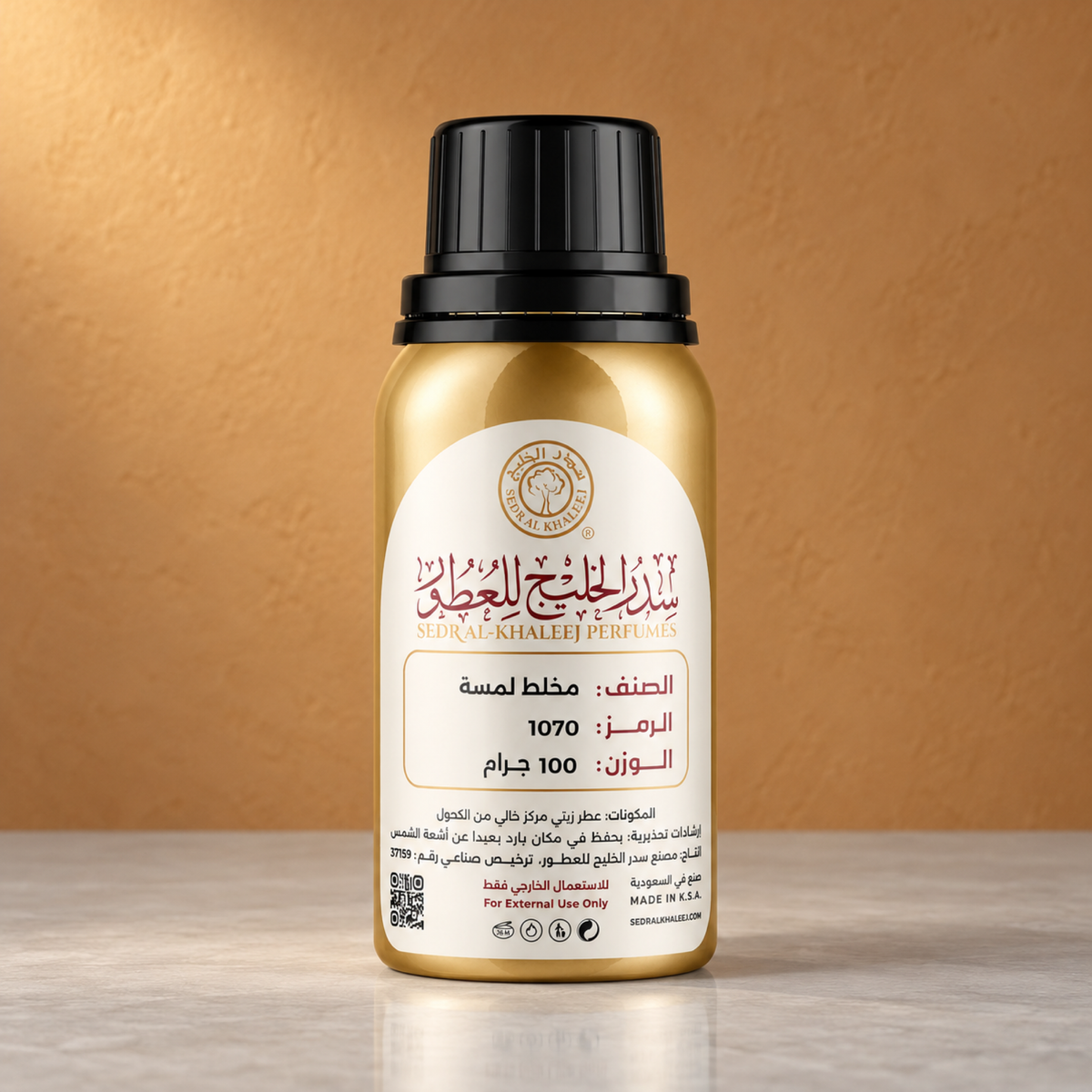 Sedr Al-Khaleej lammsah perfume oil; one closed original bottle on cool pale-grey porcelain, against plain muted saffron-clay plaster.