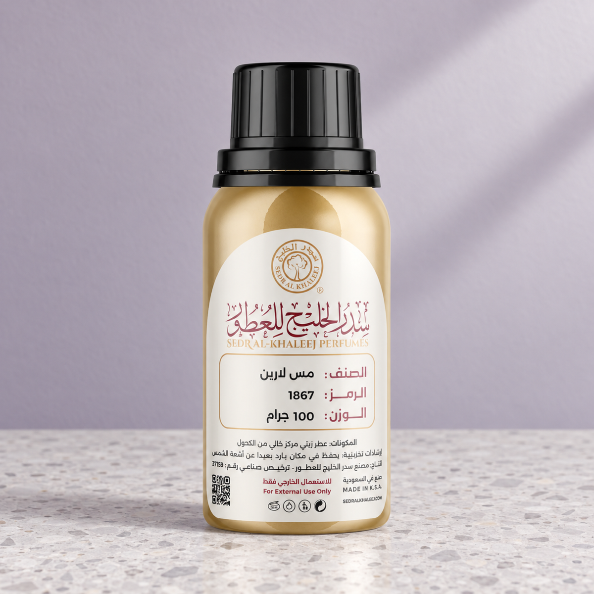 Sedr Al-Khaleej miss laren perfume oil; one closed original bottle on pale pearl-grey terrazzo before a dusty lilac, pearl grey backdrop.